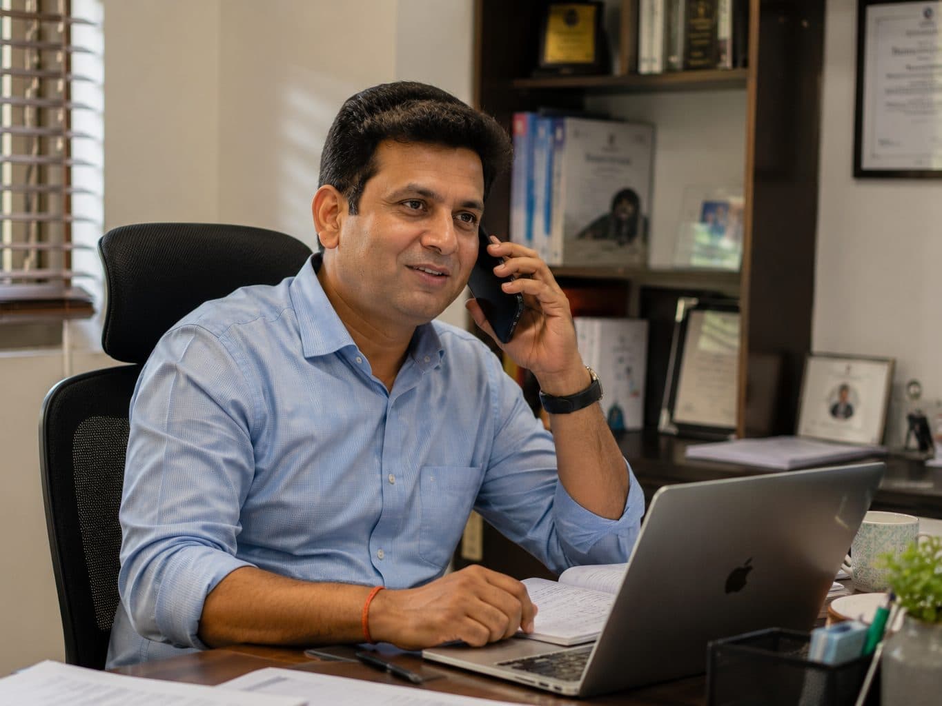 An advisor taking a call at their desk.